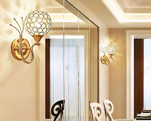 Applique lustre boule dorée en cristal